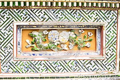 HUE, VIETNAM, April 28th, 2018: Fragment of an old wall with an ancient decorative element. Vietnam Stock Photo