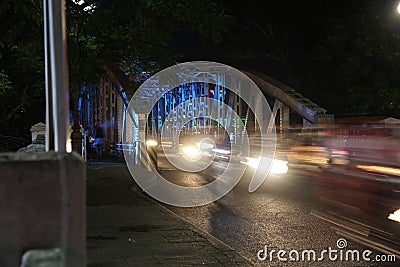 Speeding traffic on the colorful Truong Tien bridge in the Vietnamese city of Hue. (blur due to motion Editorial Stock Photo