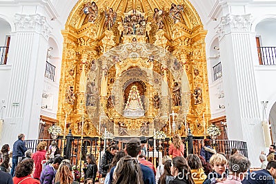 Crowd of people visiting the Image of the Virgen del Rocio, inside of the Ermita del Rocio, Editorial Stock Photo