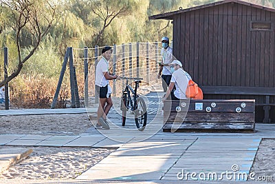 Huelva, Spain - July 4, 2020: Beach safety guards of Junta de Andalucia is controlling the access to Islantilla beach for Editorial Stock Photo