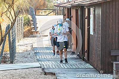 Huelva, Spain - July 4, 2020: Beach safety guards of Junta de Andalucia at the meeting and replenishment point of Islantilla beach Editorial Stock Photo