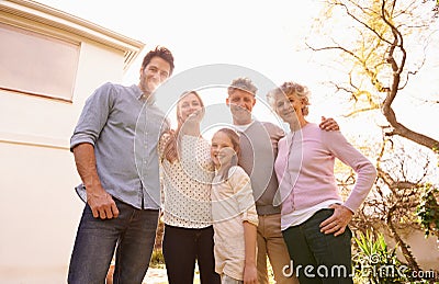 Hug, backyard portrait and big family of happy child, grandparents and parents bond, care and embrace together Stock Photo