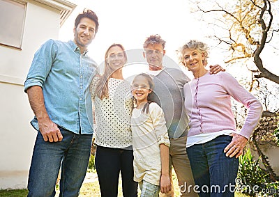 Hug, backyard portrait and happy family grandparents, parents and kid bonding, smile and spending outdoor time together Stock Photo