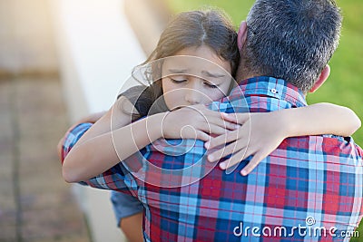 Hug, father and girl with love, sympathy and comfort with grief, loss and depression with pain. Family, female child or Stock Photo