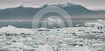 Huge blocks of ice on Glacial river and blue icebergs on Jokulsarlon glacier lake. Vatnajokull National Park, Iceland Stock Photo