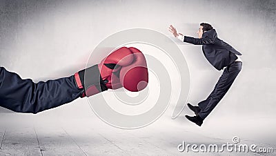 Huge Boxing Gloves punches businessman concept Stock Photo