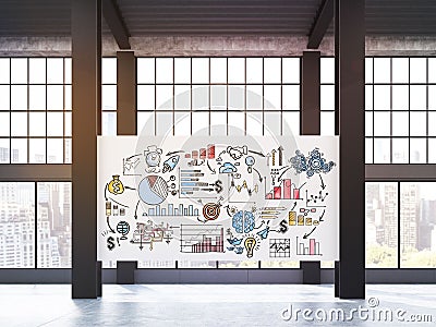 Huge business poster on pillars in loft Stock Photo