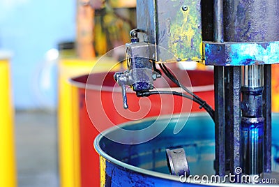 Huge cans of paint in four colors at typography Stock Photo