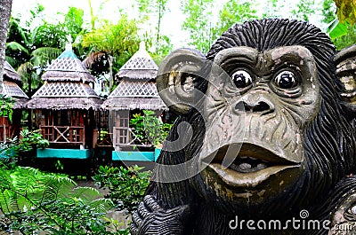 Huge concrete carved monkey statue in an Asian aquatic jungle theme park Editorial Stock Photo