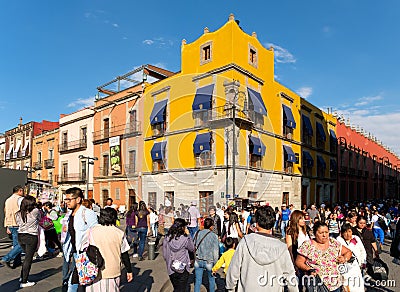 Huge crowd and colorful buildings at the historic center of Mexico City Editorial Stock Photo