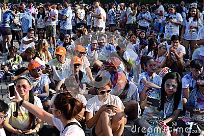 Huge crowd of Young people gather at Color Manila Glitter Run on city square. Public Event Editorial Stock Photo