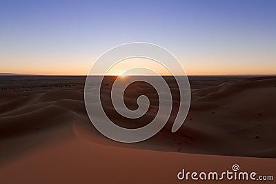 Huge desert dunes of Erg Chigaga, at the gates of the Sahara, at sunset. Morocco. Concept of travel and adventure Stock Photo