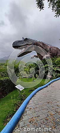 Huge Dinosaur in Park Stock Photo