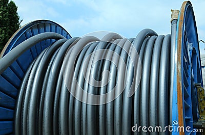 Huge electric cable reel in the construction of the power plant Stock Photo