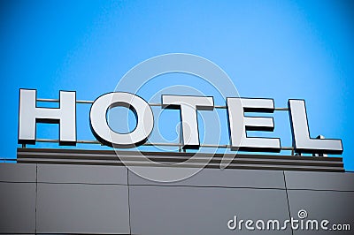 Huge electric hotel sign on the gray building Stock Photo