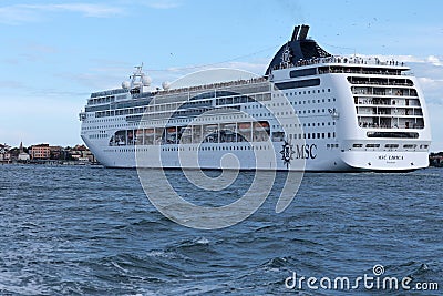 Huge ferry cruising in Venezian lagoon, Italy. Tourists on roof top Editorial Stock Photo