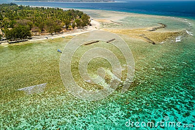 A huge fringing coral reef along the coast of a small tropical island chain Stock Photo