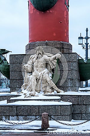 Russia, St. Petersburg, January 2021. The figure of Neptune at the foot of the red column. Editorial Stock Photo