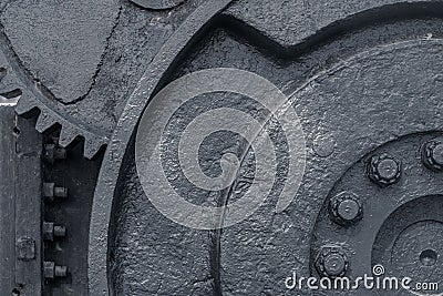 Huge metal wheels gears and mechanisms of the machine. Grunge industrial background. Layers of peeling paint on the metal Stock Photo