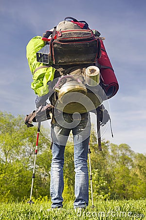 Huge novice backpack in the mountains Stock Photo