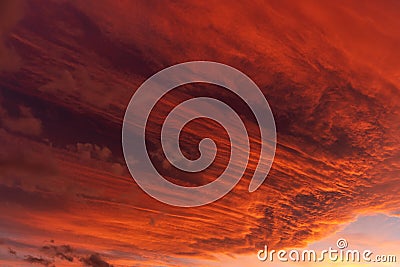 Huge orange cloud in the sky at sunset Stock Photo