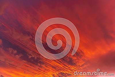 Huge orange cloud in the sky at sunset Stock Photo