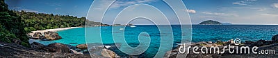 Huge Panorama of Perfect Tropical Island beach and rocks with tu Stock Photo