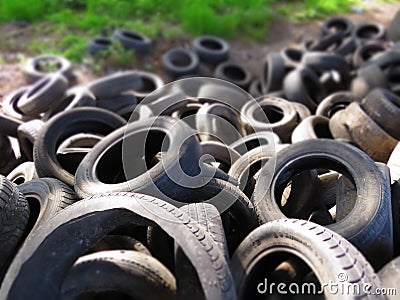 Huge piles from old car tires under a bridge in Varna, Bulgaria. Pollution all around. Editorial Stock Photo