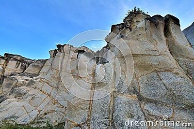 Huge rock as decayed granite with featured pattern Stock Photo
