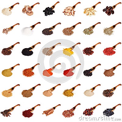 Huge set of spices, dried fruits, nuts, herbs and beans on the wooden spoon isolated on white. Stock Photo