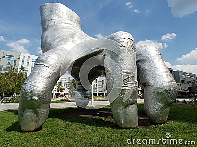 Huge Silver hand sculpture in University Circle uptown district of Cleveland Editorial Stock Photo