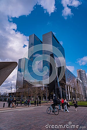 Huge skyscrapers in Rotterdam. Gebouw Delftse Poort a tall glassy building next to the central railway station Editorial Stock Photo