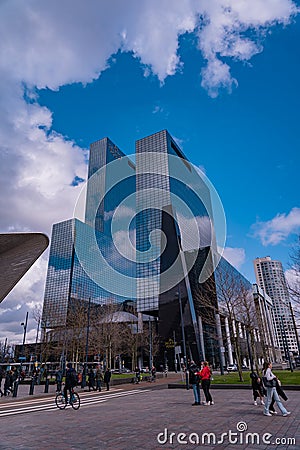 Huge skyscrapers in Rotterdam. Gebouw Delftse Poort a tall glassy building next to the central railway station Editorial Stock Photo