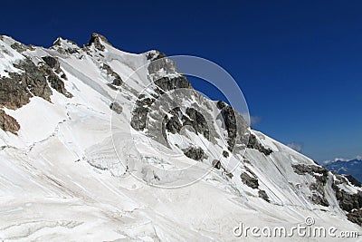 Huge snow and rocky mountain Stock Photo