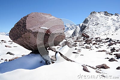 Huge stone block like mushroom in snow mountains Stock Photo