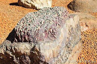 A huge stone with magical beautiful pink and white quartz Stock Photo