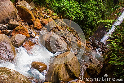 The huge stones near the waterfall Casaroro. Philippines. Valencia, island Negros. Stock Photo