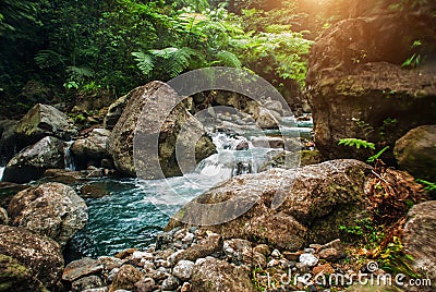 The huge stones near the waterfall Casaroro. Philippines. Valencia, island Negros. Stock Photo