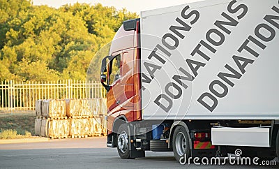 huge truck move with donation supplies inside, help to the poor coutries on the earth Stock Photo
