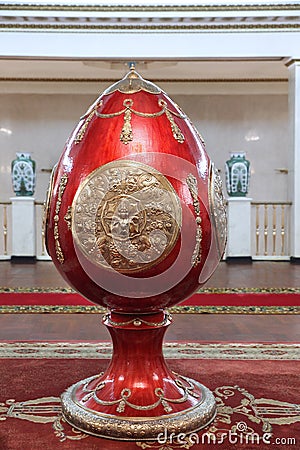 Huge vintage red egg in the Faberge style at the Sovetsky Hotel. Moscow. 06.10.2016 Editorial Stock Photo