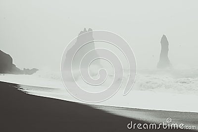Huge waves against rocks monochrome landscape photo Stock Photo
