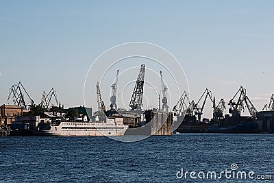 A huge white ship with tourists who travel. Port in St. Petersburg in the sea bay, Stock Photo