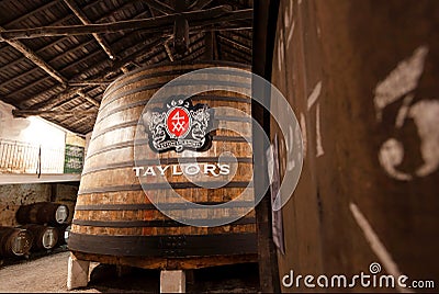 Huge wooden barrel inside the old winery Tailor`s, it making porto wine from 1692 in traditional winemaking Editorial Stock Photo