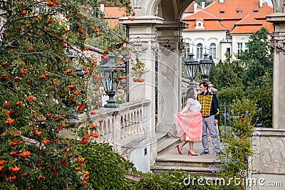 Hugging couple in baroque gazebo at terraced gardens below Prague Castle, Small FÃ¼rstenberg garden in district Lesser Town Mala Editorial Stock Photo