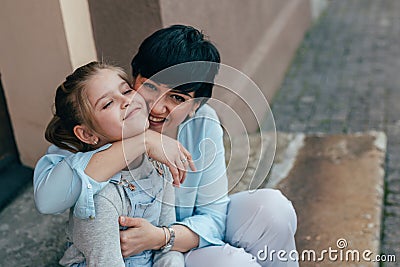 Hugging her little daughter Stock Photo