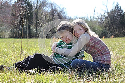 Hugging Sister Stock Photo