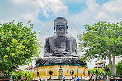 Hugh Buddha statue in Eight Trigram Mountains Buddha Landscape Editorial Stock Photo