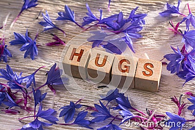 Hugs on the wooden cubes Stock Photo