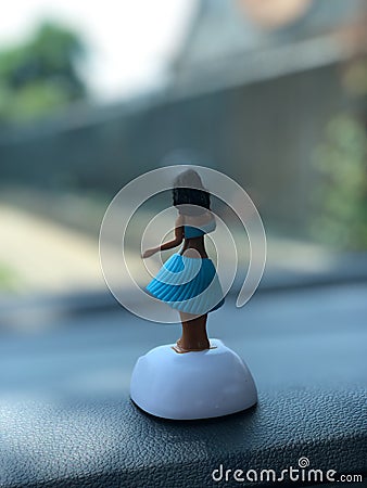 Hula dancer on dashboard of car Stock Photo