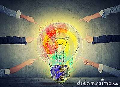Human arms fingers point at idea colorful light bulb Stock Photo